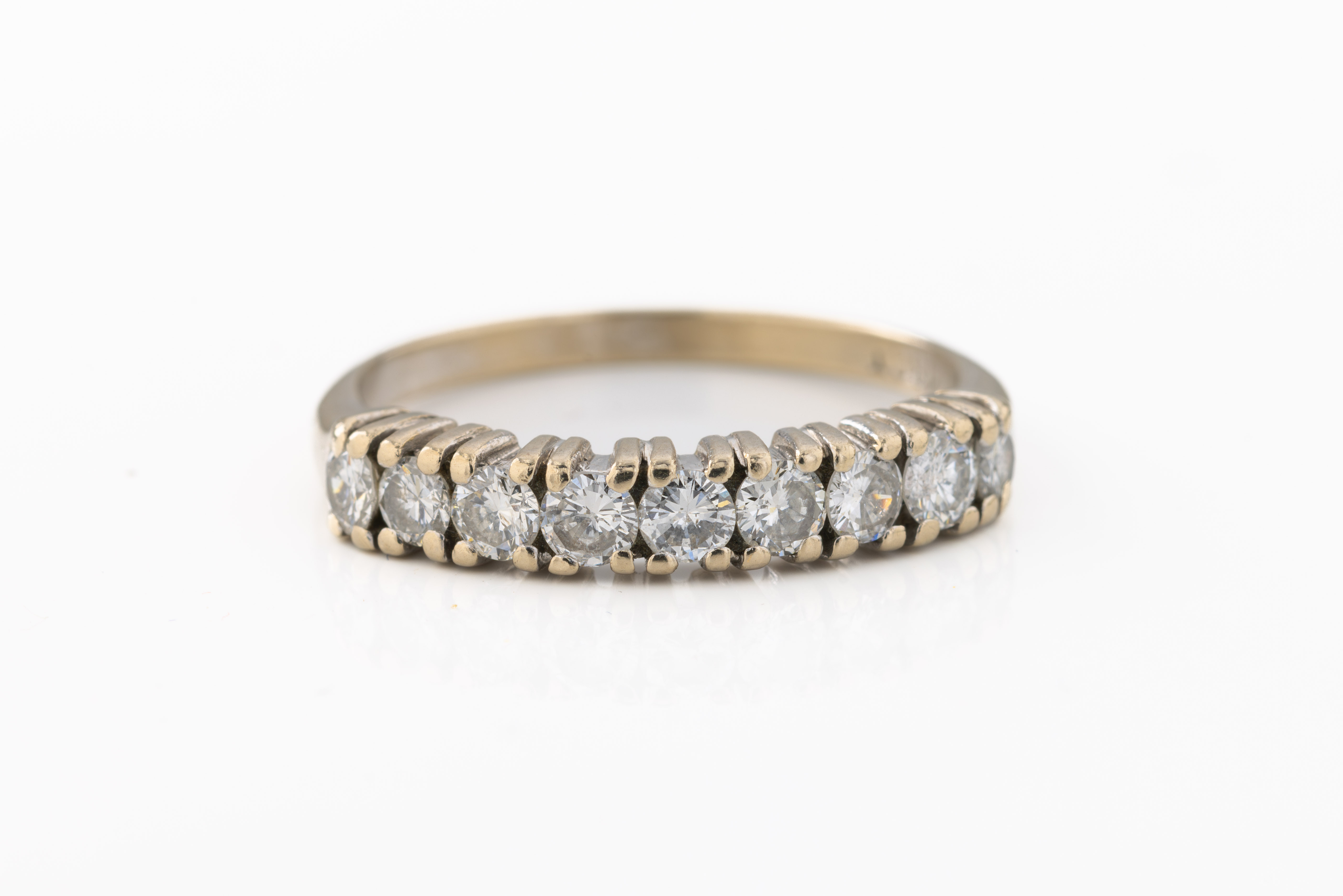 An 18ct white gold half eternity ring