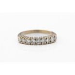An 18ct white gold half eternity ring