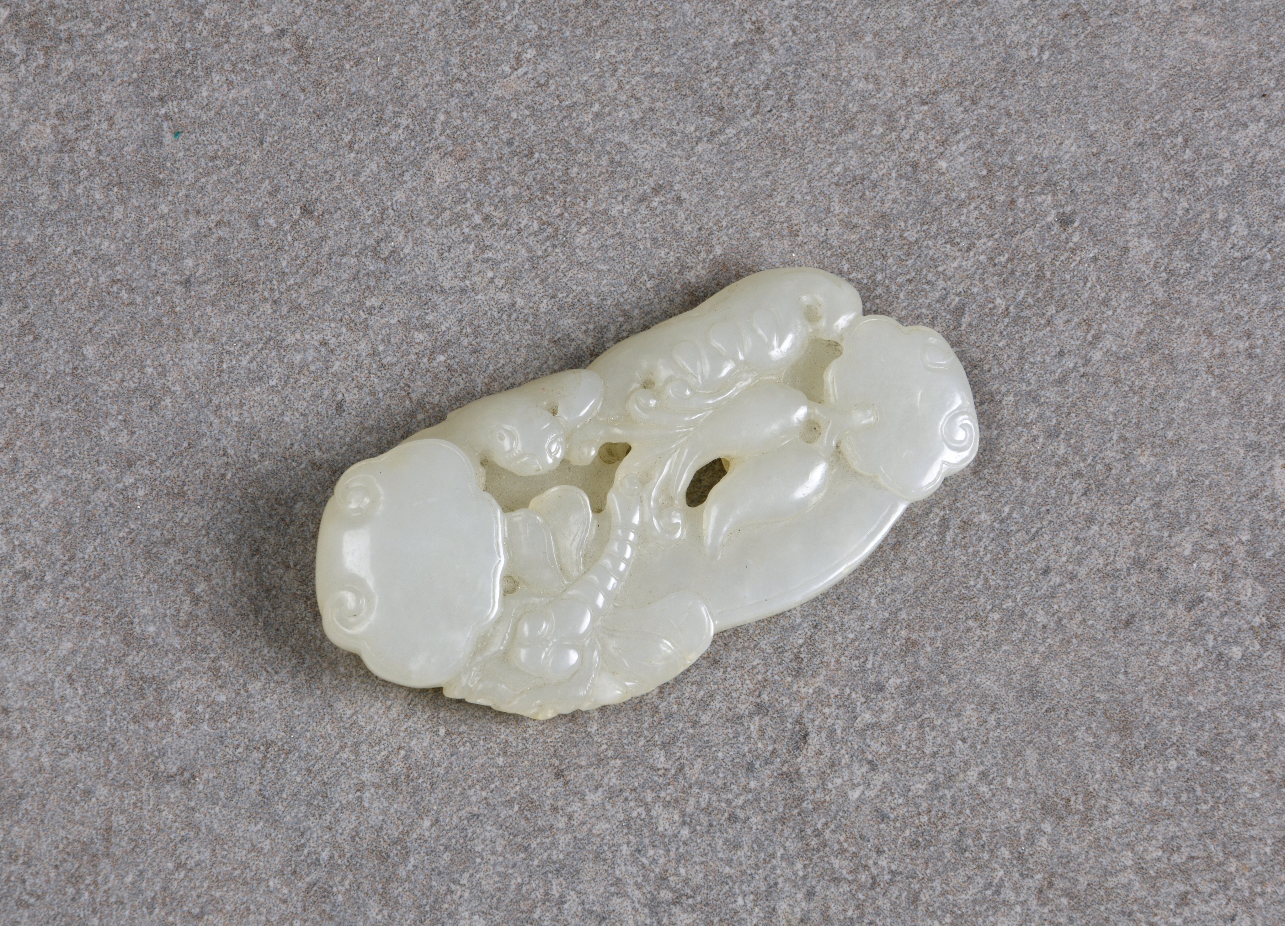 A Chinese very pale celadon jade carving