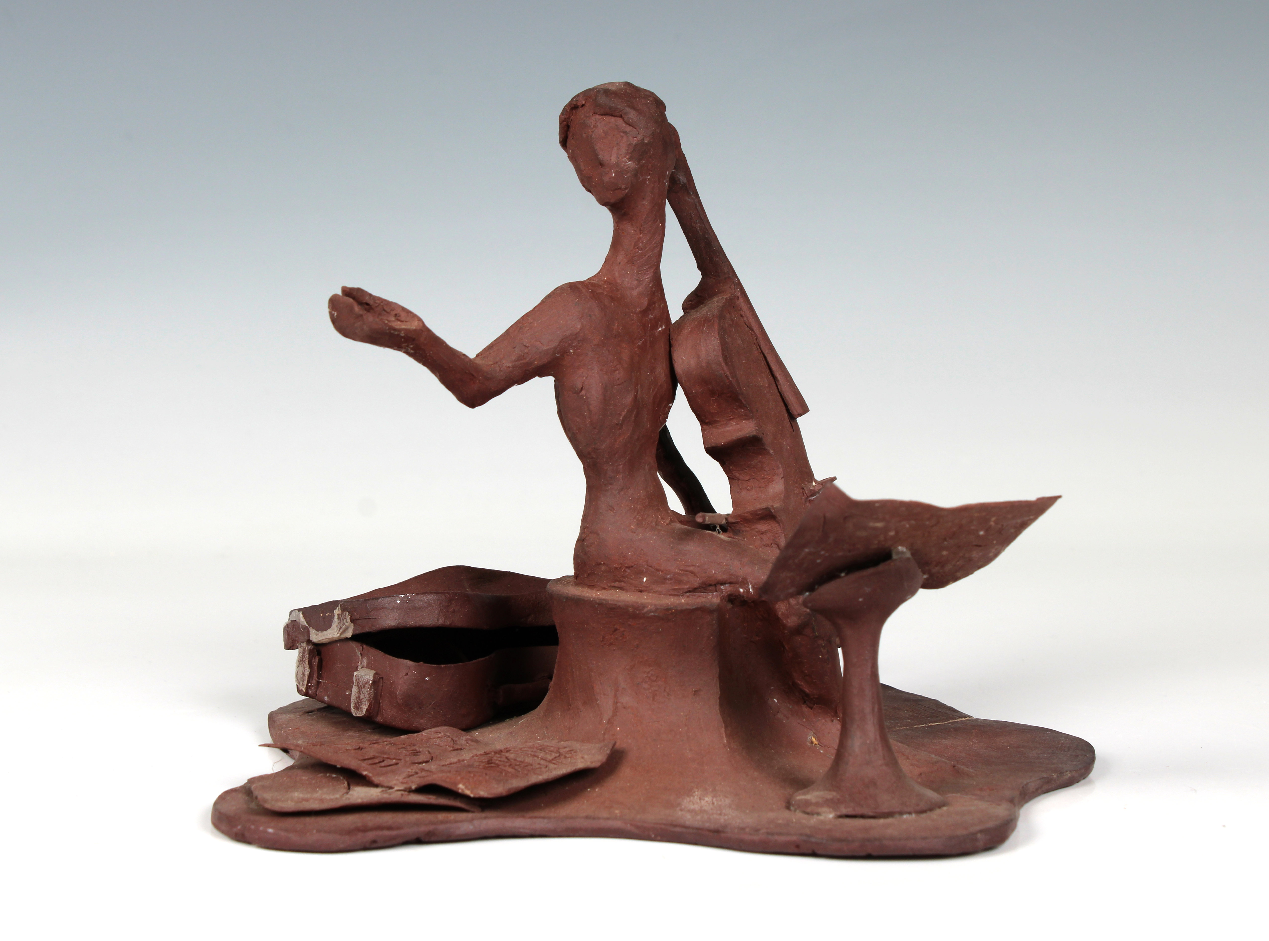 Elizabeth Ann Macphail (1939-89) An unglazed stylised cellist or double bass player sculpture