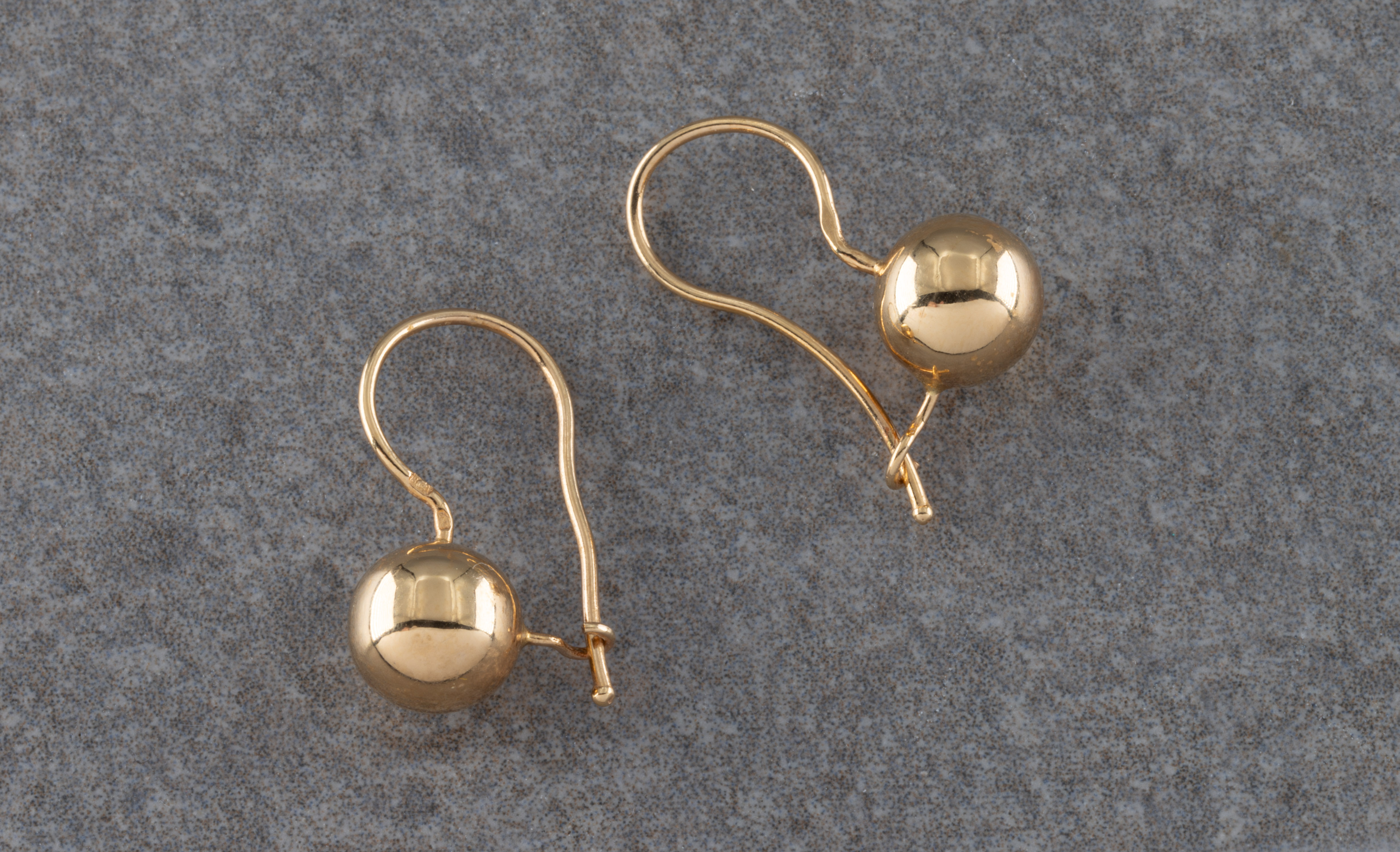 A pair of yellow metal spherical earrings