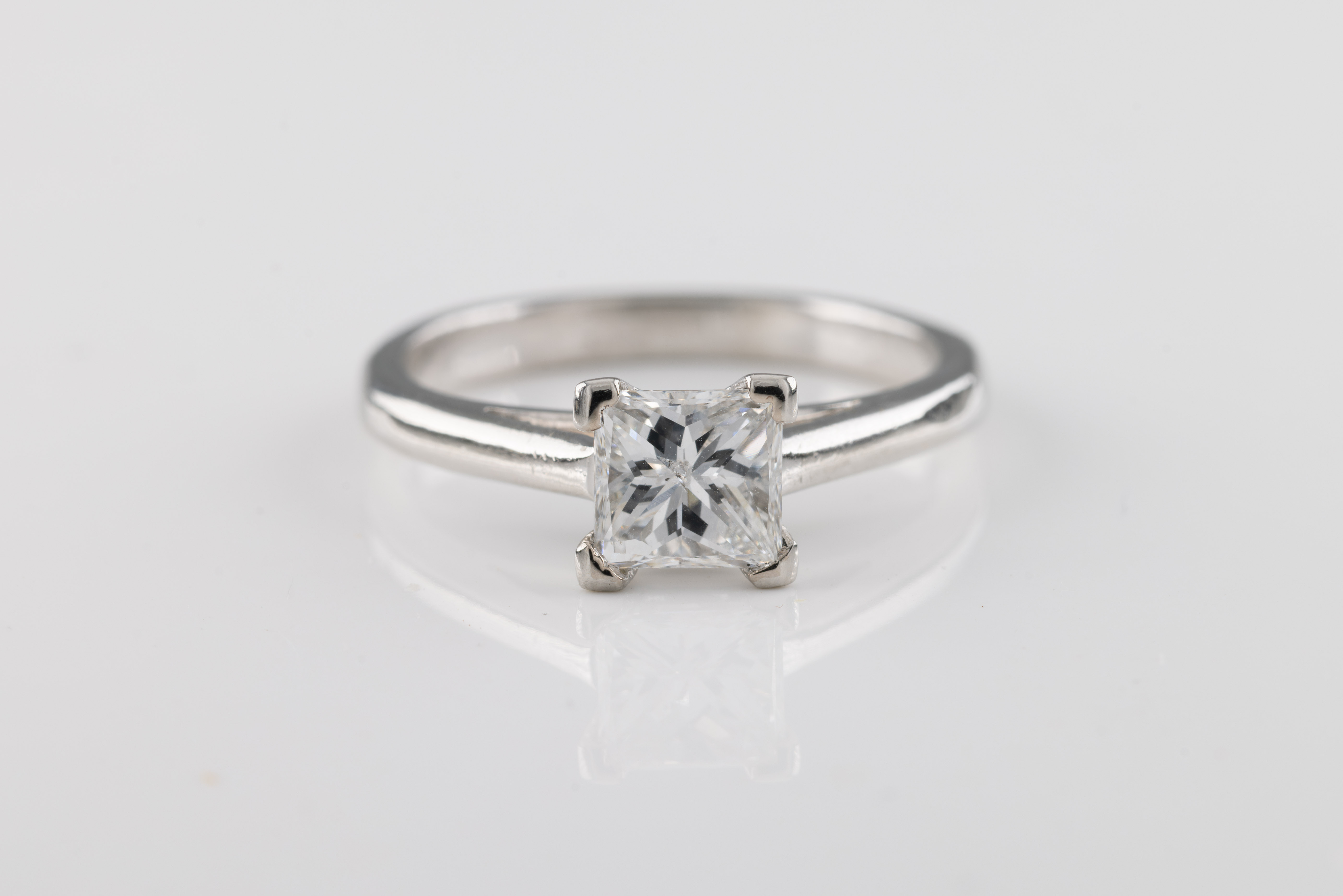 A princess-cut diamond solitaire ring