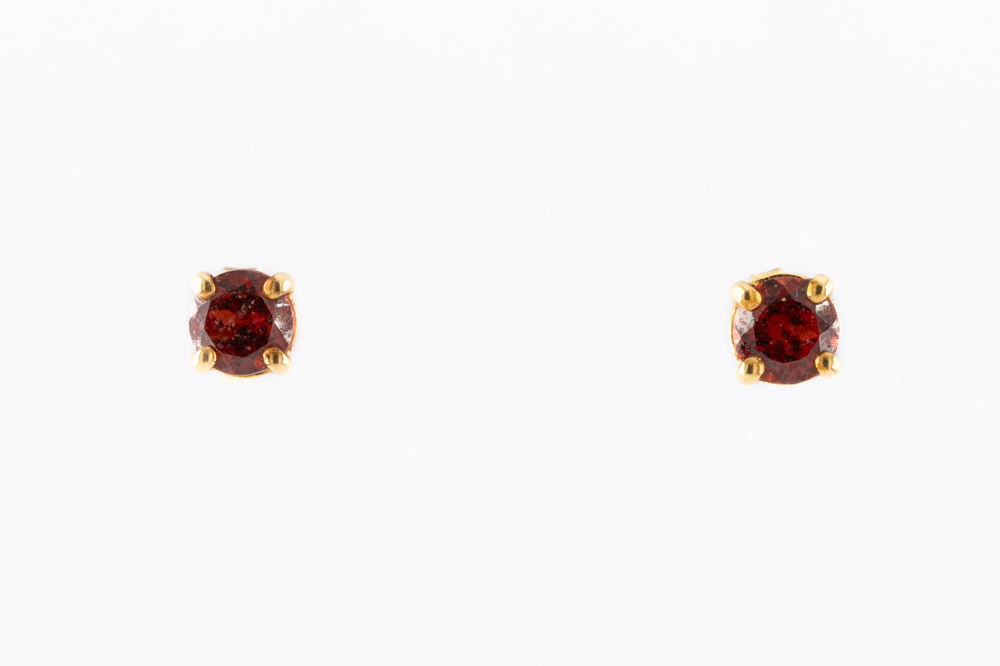 A pair of 18ct yellow gold and garnet earrings