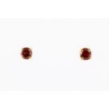 A pair of 18ct yellow gold and garnet earrings