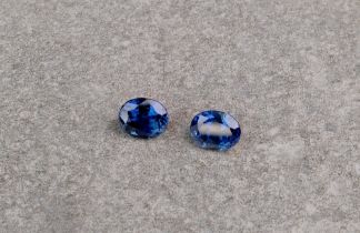 A pair of loose, oval cut blue sapphire