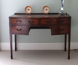 A late George III mahogany bowfront dressing table