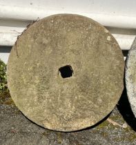 A sandstone mill stone