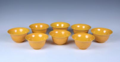 A set of eight Chinese yellow glazed anhua bowls
