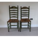 Two green painted ladderback chairs