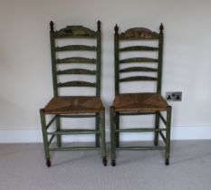Two green painted ladderback chairs