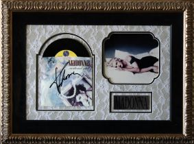 Madonna - Framed display of colour image and 45 record 'Material Girl' sleeve signed