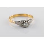 A yellow gold and diamond solitaire ring