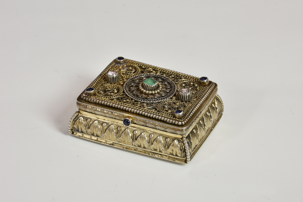 An Indian or Persian silver gilt and jewelled snuff box