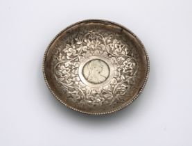 A silver bowl inset with a silver 1780 Maria Theresa Thaler coin