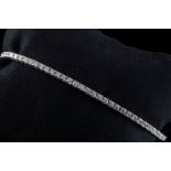 An 18ct white gold diamond line bracelet