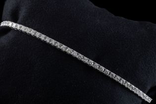 An 18ct white gold diamond line bracelet