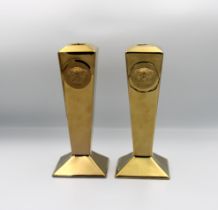 A pair of Rosenthal Versace metallic gold glazed candlesticks, Medusa masks to sides