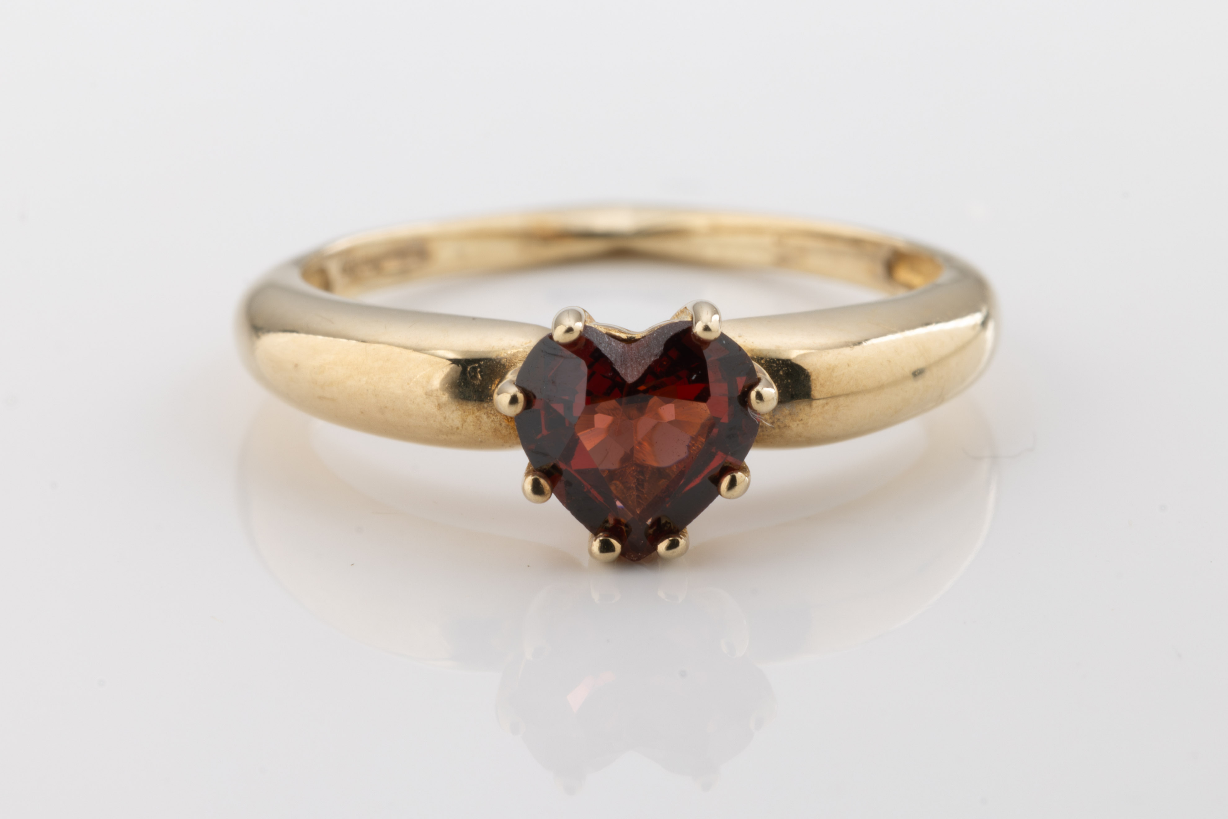 A heart-shaped garnet gemstone solitaire