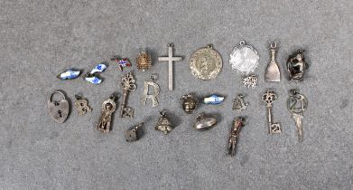 A collection of silver charms and pendants