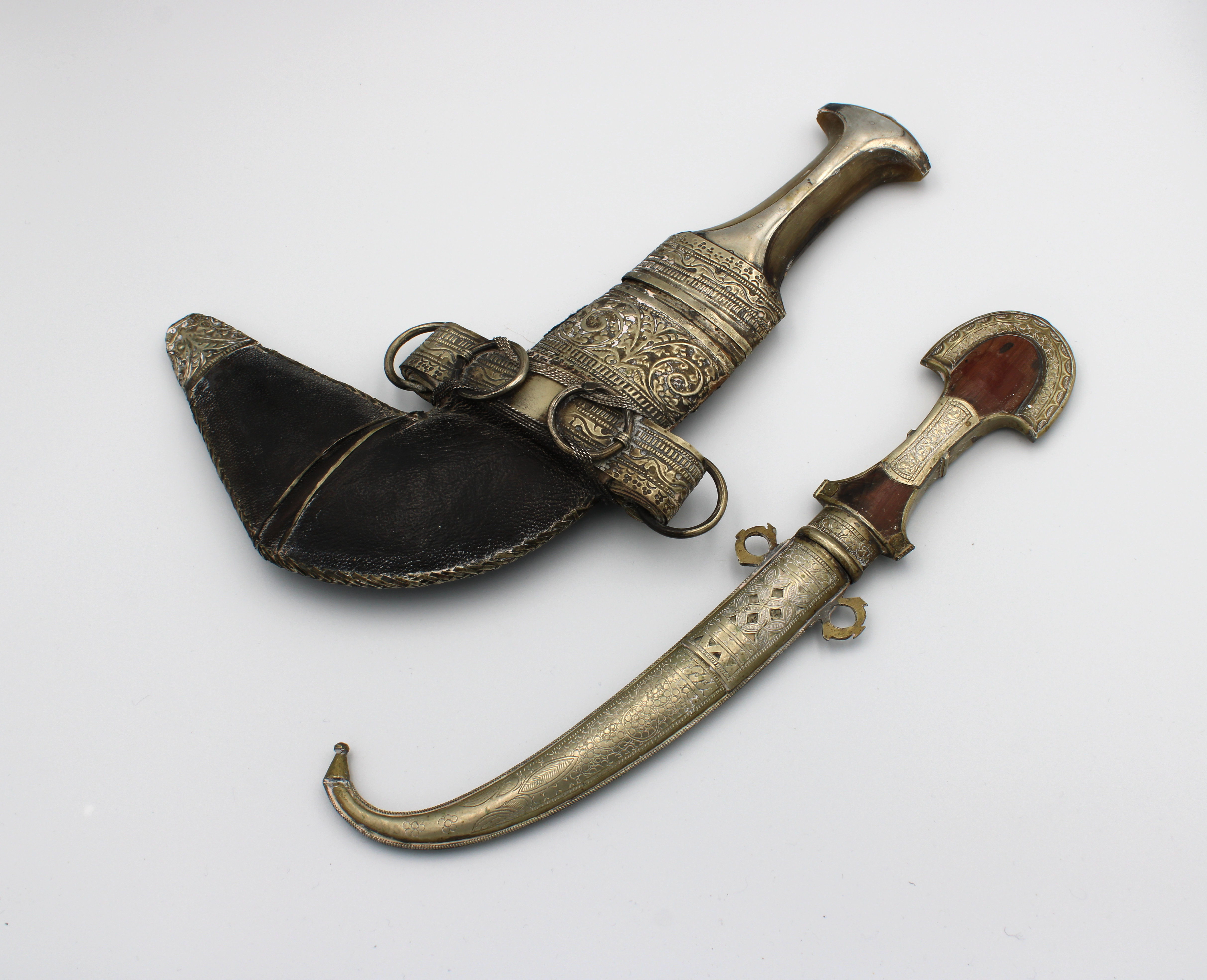 A Bahraini silver Jambiya dagger with a shaped horned handle