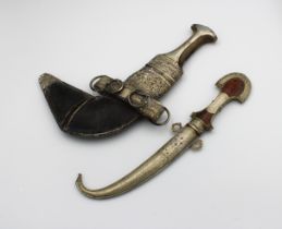 A Bahraini silver Jambiya dagger with a shaped horned handle