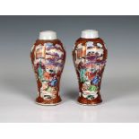 A pair of Chinese famille rose early 19th century baluster vases