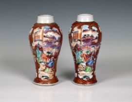 A pair of Chinese famille rose early 19th century baluster vases