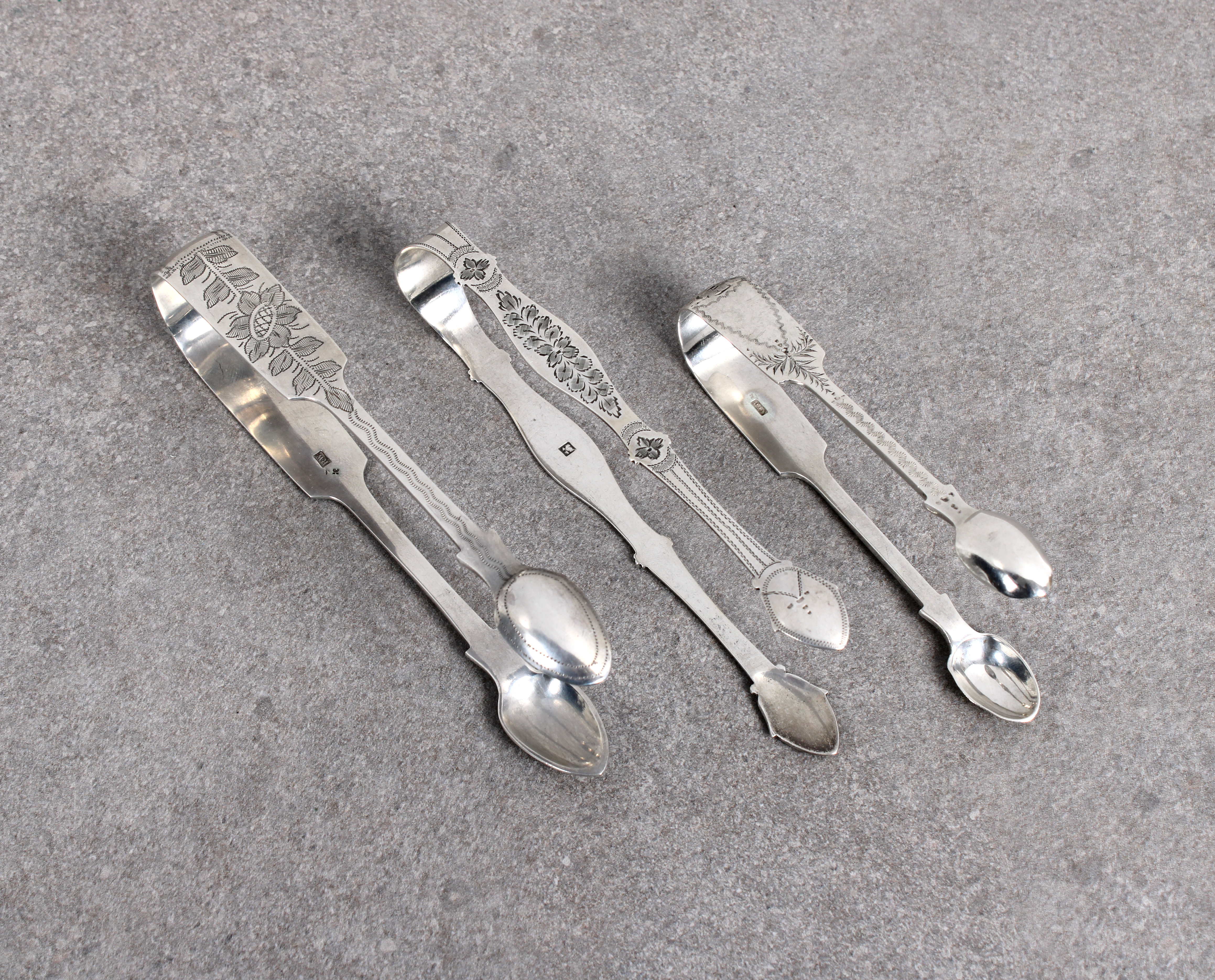Three pairs of silver sugar tongs - To include a pair of provincial West Country silver tongs