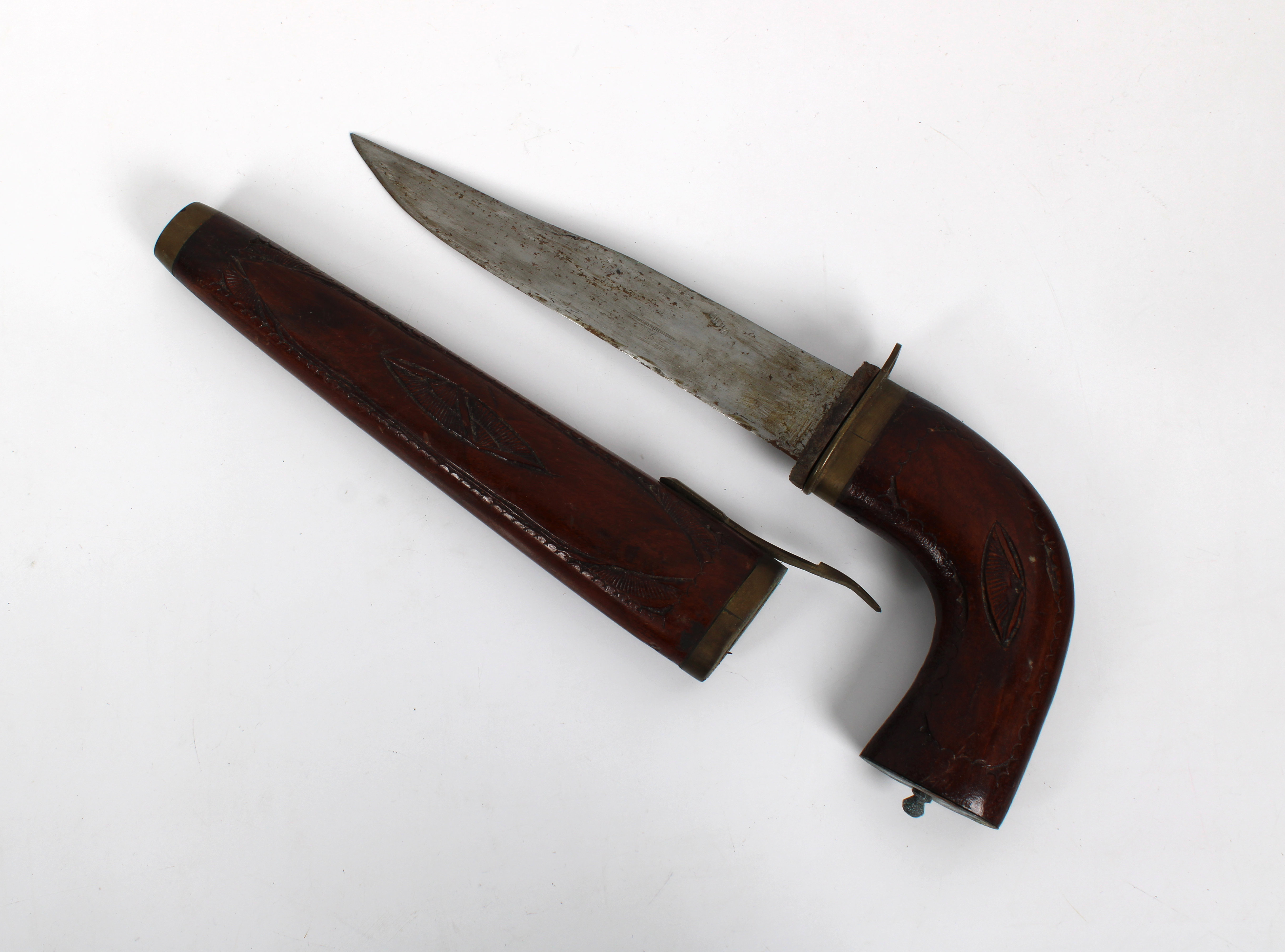 An unusual steel dagger, the blade stamped "India", set into a pistol form curved wood handle that l
