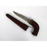 An unusual steel dagger, the blade stamped "India", set into a pistol form curved wood handle that l