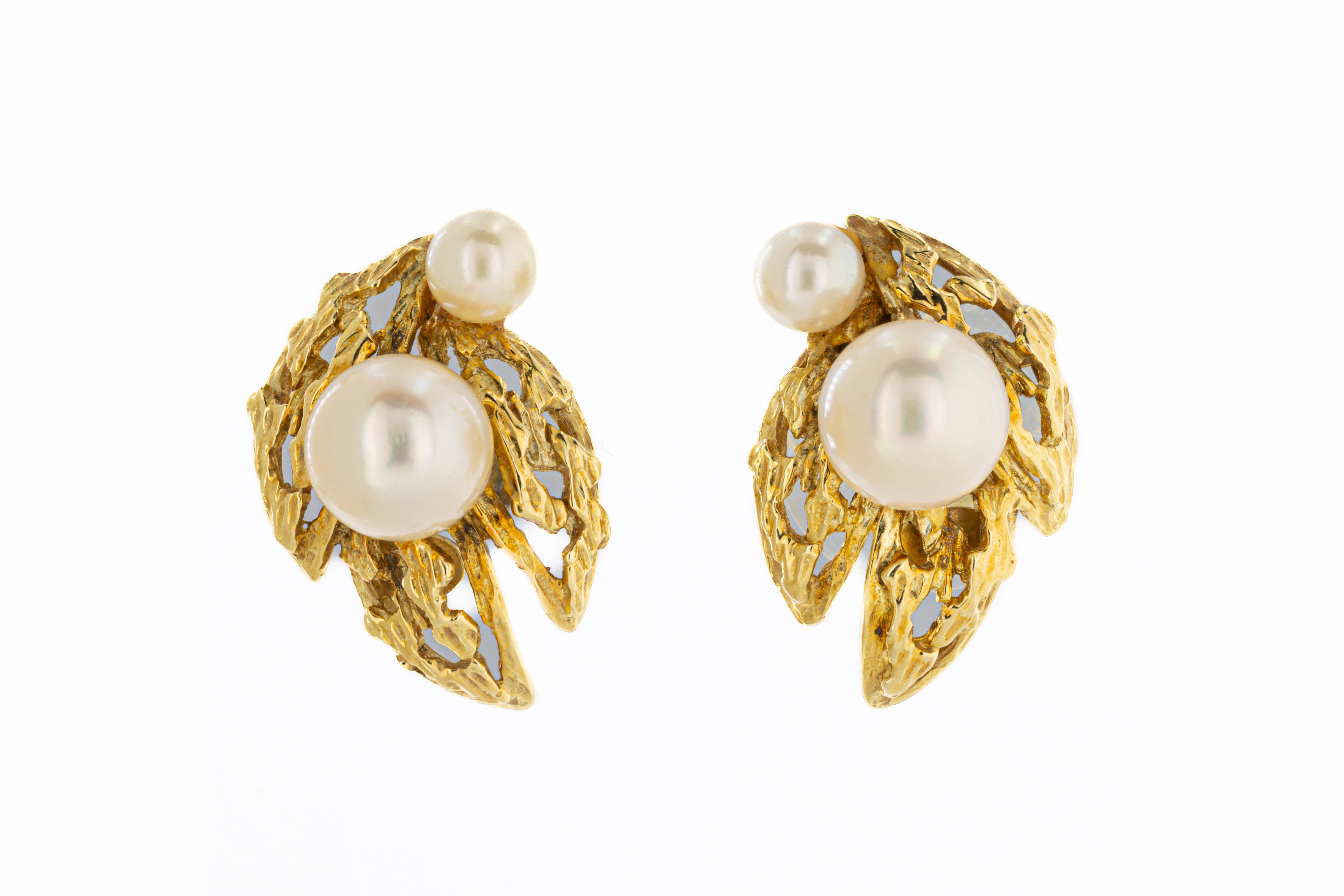 A pair of pearl gold leaf earrings