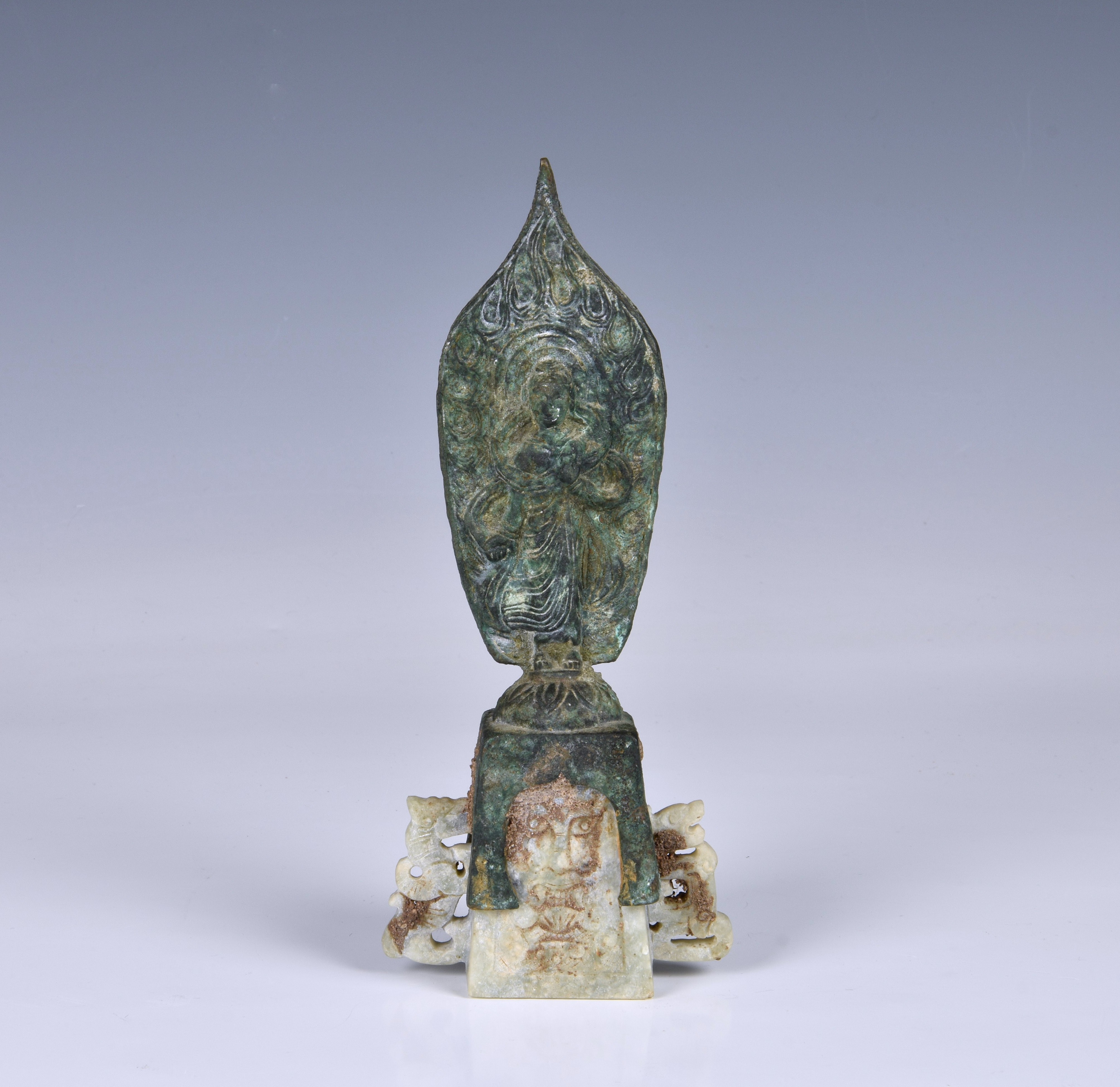 A Chinese bronze and calcified jade Northern Wei figure of Guanyin