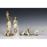 A group of four Nao and Lladro figures