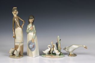 A group of four Nao and Lladro figures