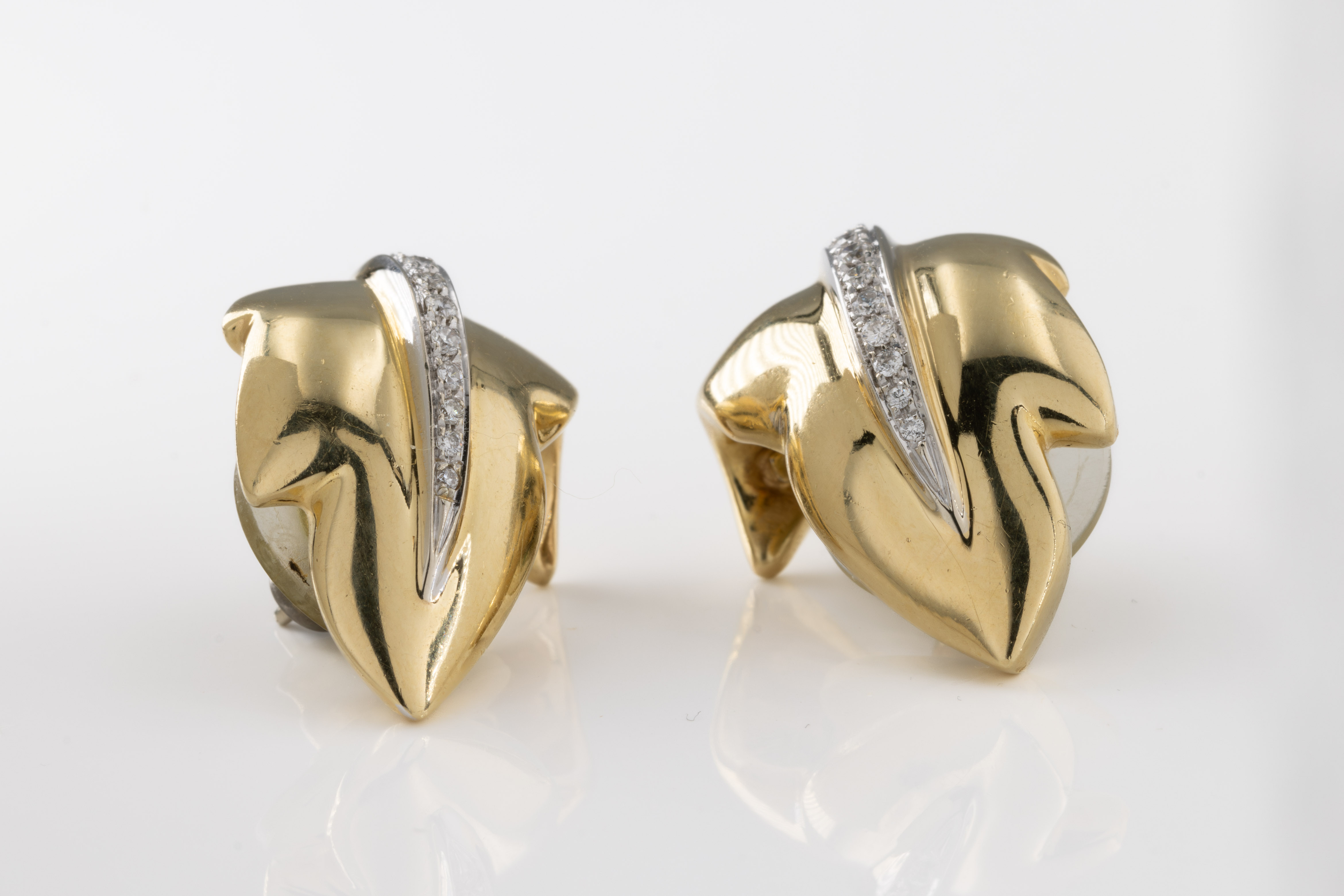 A pair of 18ct yellow gold and diamond leaf earrings