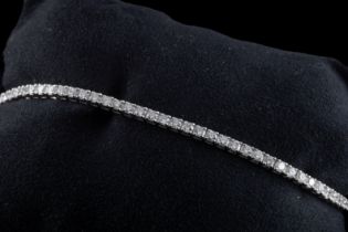 An 18ct white diamond line bracelet