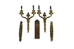 A pair of Louis XVI style twin light gilt metal wall appliques