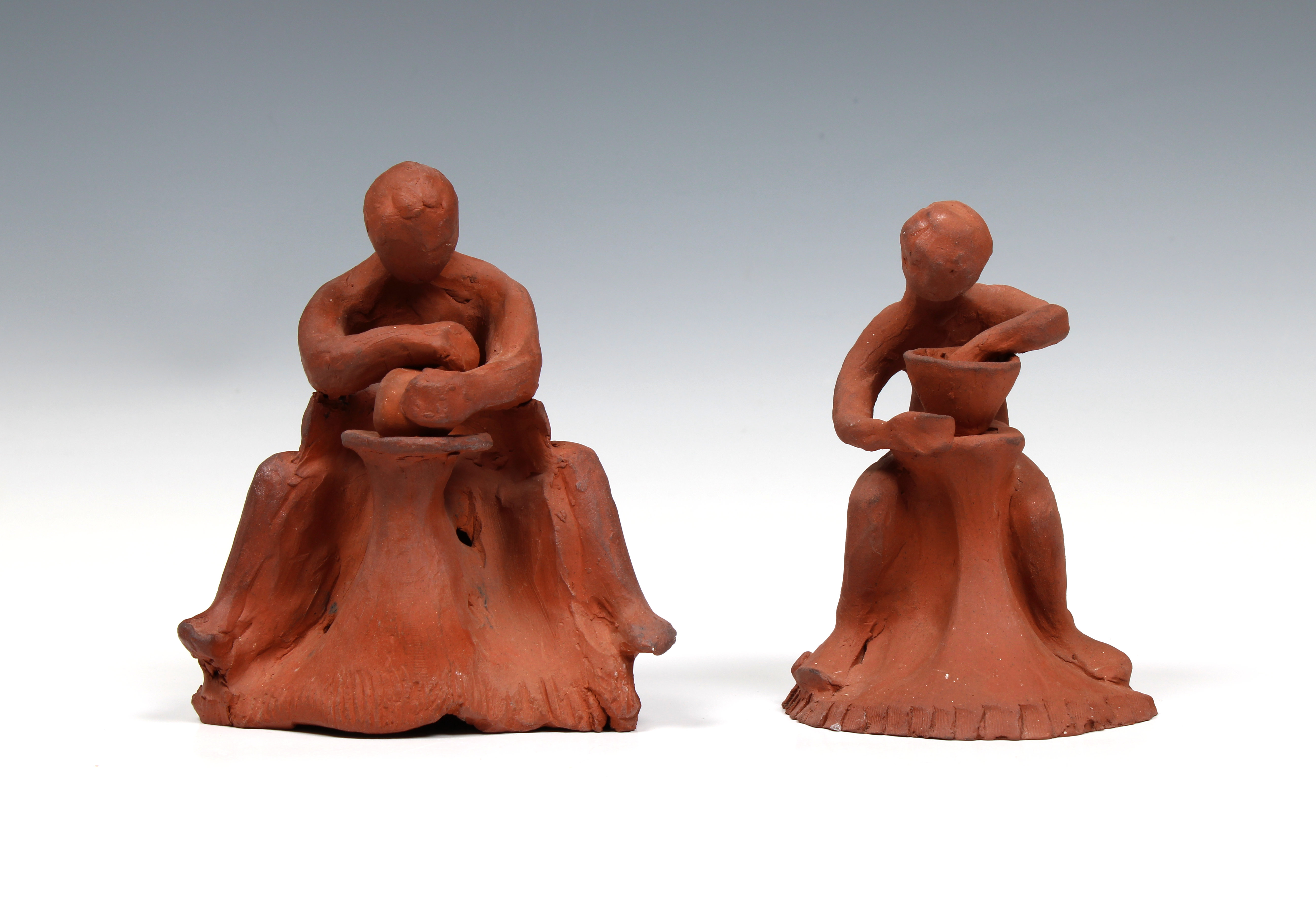 Elizabeth Ann Macphail (1939-89) Two unglazed sculptures depicting potters at a wheel