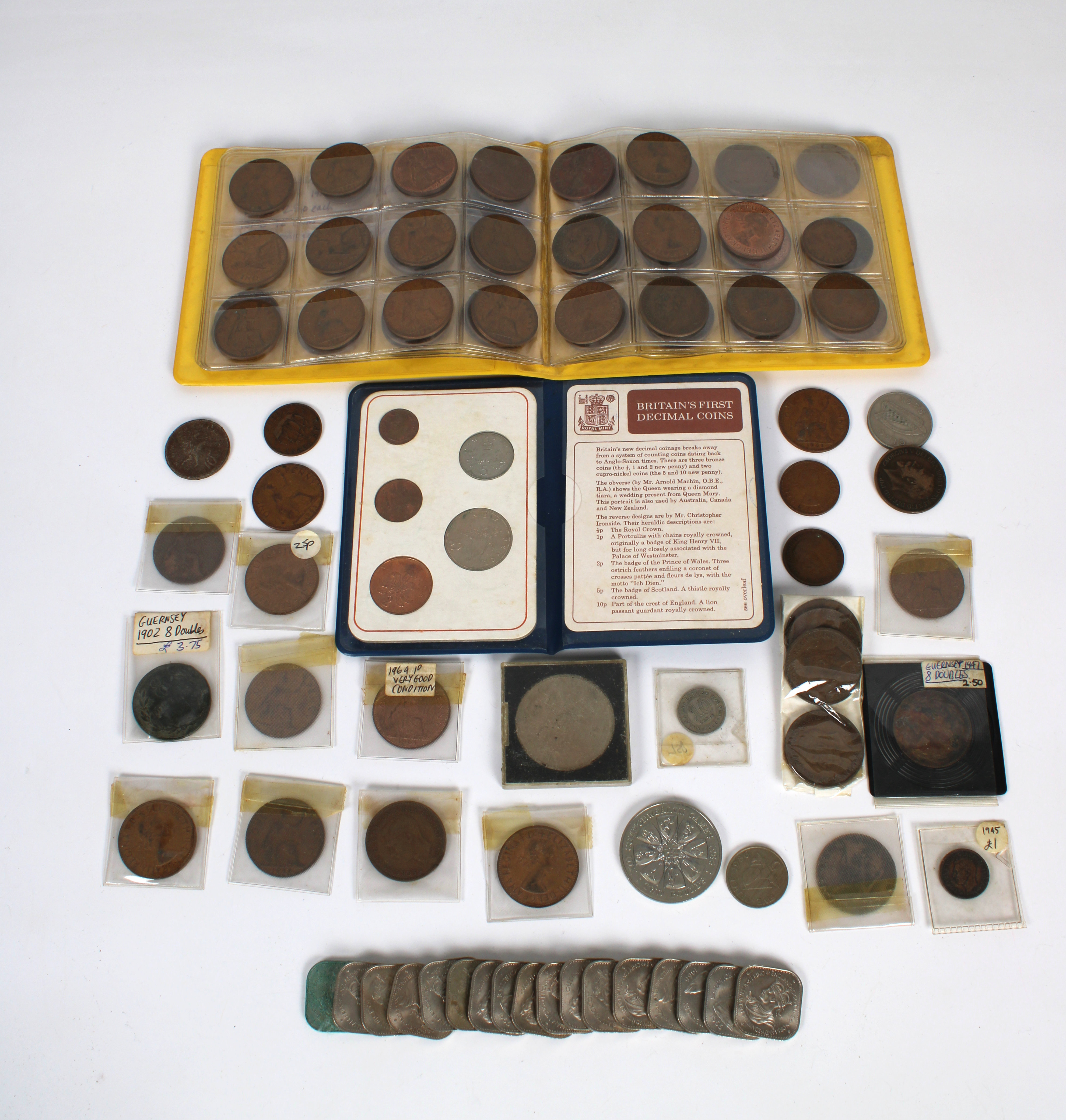 A collection of vintage Guernsey and British coinage