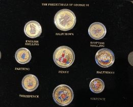 Display case with Gold coloured (may be plated) versions of pre-decimal coins of GVI