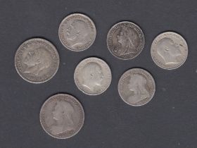 Seven early UK silver coins, five 3d's and two 6d's