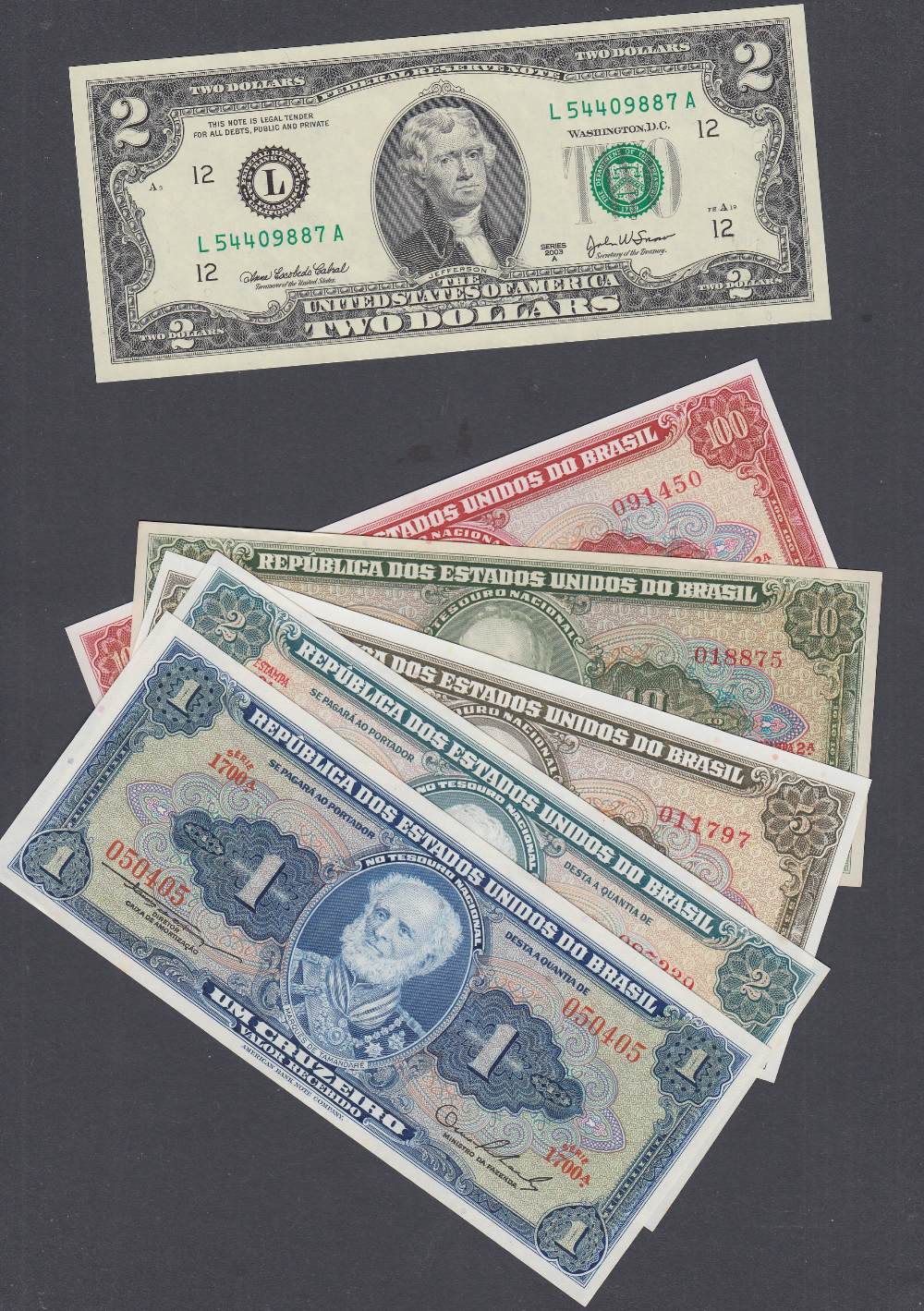 Small accumulation of uncirculated banknotes from Brazil