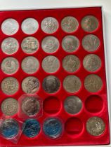 Collection of QEII Crowns and £5 coins in display tray (27)
