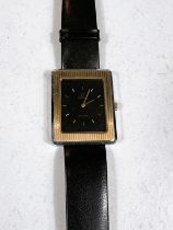 An OMEGA DE VILLE c. 1975, rectangular dial inset with 14ct gold bezel, deep brown dial, movement