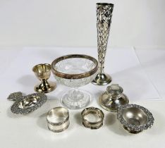 A hallmarked silver overlaid specimen vase; a pedestal dish with silver rim; a silver capstan