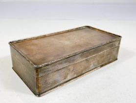 A hallmarked silver rectangular cigarette box with engine turning, Birmingham 1926