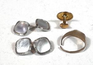 A yellow metal stud and ring, stamped '9ct', 2.5gm; a white metal and mother-of-pearl cufflinks,