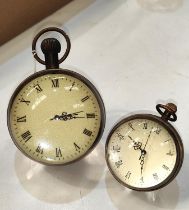 Two glass spherical 'Bullseye' time pieces, one larger one smaller