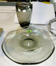 A SMOKED GLASS dish of heavy lobed form, engraved mark, 30cm, a similar vase with bubble inclusions,