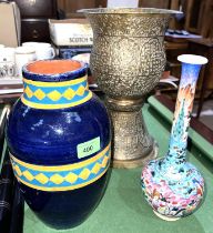 A 20th century Iznik style vase with colourful glaze; a Middle Eastern brass vase on pedestal